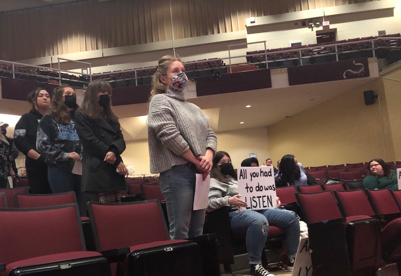 Current students, alumni, and parents line up to address the Stow-Munroe Falls Board of Education about the district's response to the Concerned Students of Stow-Munroe Falls Instagram page — courtesy of Krista S. Kano, Akron Beacon Journal.