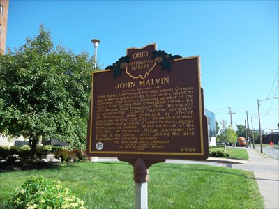 A sign documenting the work of Black canal boat captain John Malvin, who transported runaway slaves.