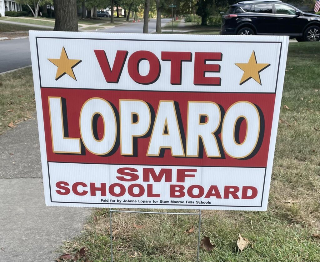 A "Vote Loparo for SMF School Board" sign. A "Vote Loparo for SMF School Board" sign.