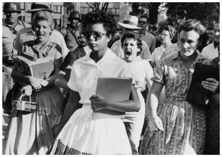 Ruby Bridges walking to the entrance of her school while being yelled at by white students in the wake of integration stemming from the ruling in Brown v. Board of Education. Ruby Bridges walking to the entrance of her school while being yelled at by white students in the wake of integration stemming from the ruling in Brown v. Board of Education.